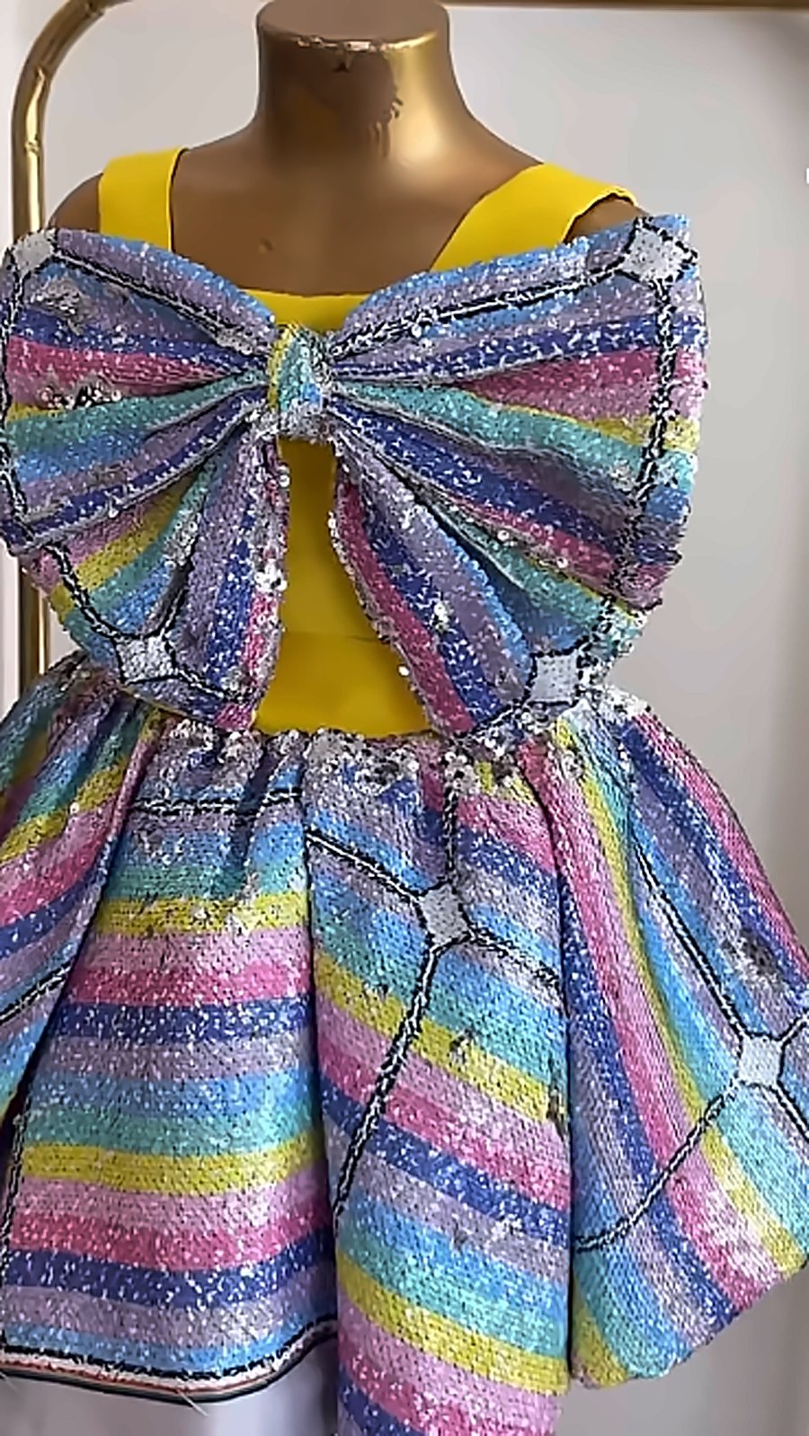 Rainbow sequin dress with a big bow